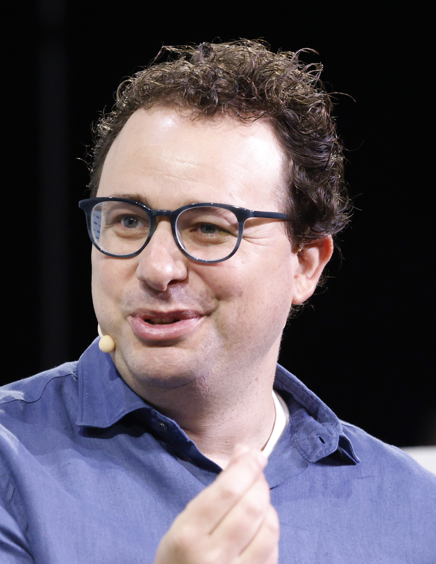 Dario Amodei speaking onstage at TechCrunch Disrupt 2023.