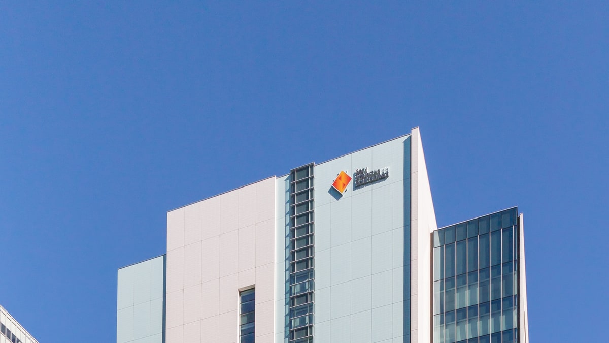 Sony Interactive Entertainment's Tokyo office building against a clear blue sky.